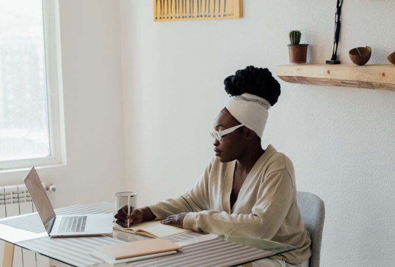 Person journalling at their desk